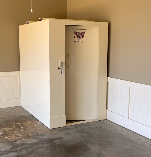 Steel tornado shelter installation with custom door placement